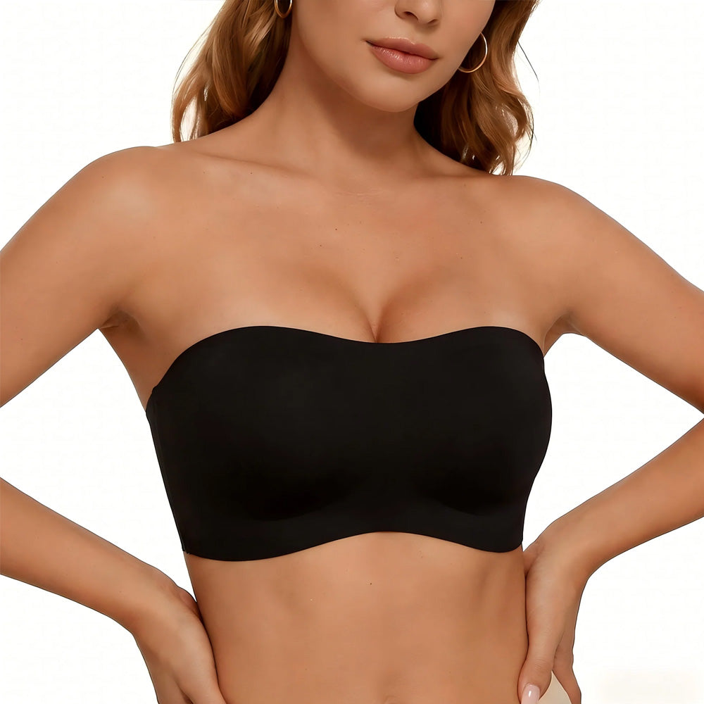 Black strapless top worn by a model on a plain background